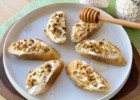 Crostini with mascarpone, pistachios, pine nuts and honey